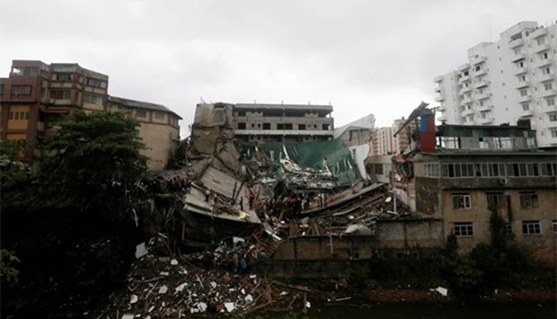 Rescue work is on at the site of a building collapse in Colombo on Thursday.