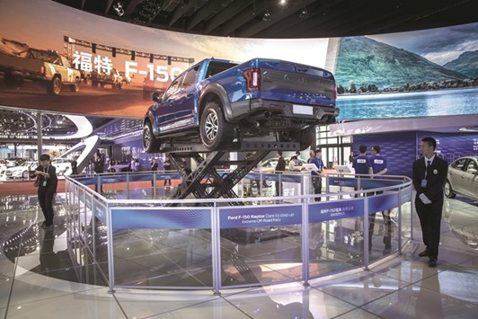 A Ford F-150 Raptor pick up truck stands on display at the Auto Shanghai 2017 show in Shanghai. The automaker will offer financial incentives, including generous early retirement offers, to encourage salaried employees to depart voluntarily by the end of September.