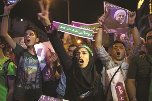 Supporters of Iranu2019s President Hassan Rouhani take part in a campaign rally in Tehran late on Wednesday.