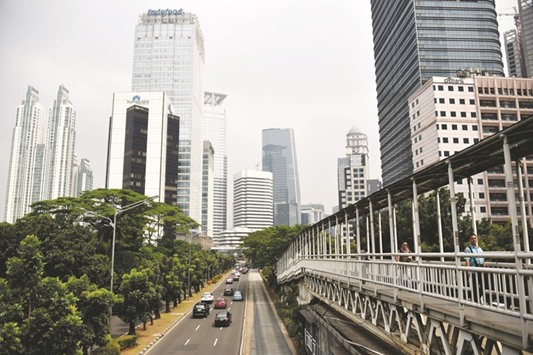A general view of high-rise buildings and skyscrapers in Jakarta. Standard and Pooru2019s have raised Indonesiau2019s sovereign credit rating to investment grade, in line with the other two major rating agencies, in a move likely to attract more investment into South-east Asiau2019s top economy.