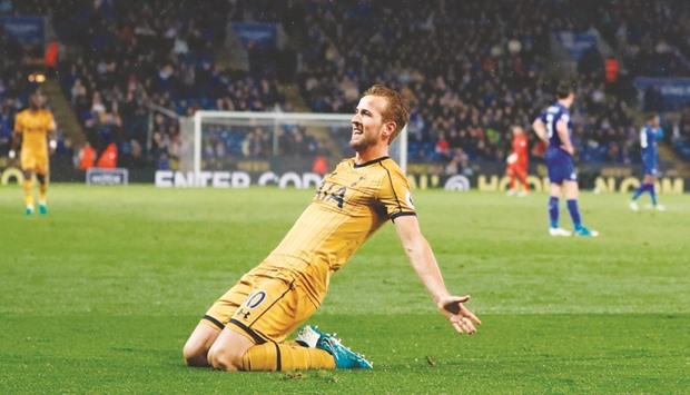 Tottenham Hotspuru2019s English striker Harry Kane celebrates scoring his third goal, their fifth, during the English Premier League match against Leicester City in Leicester. (AFP)