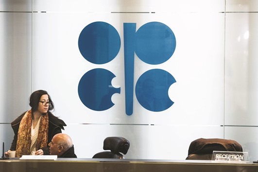 A logo is seen behind the reception desk at the Opec secretariat in Vienna. The respondents of a Bloomberg survey were split on whether the extension in production cut will last for six or nine months, and were also at odds over the probability of the cuts rebalancing the market.