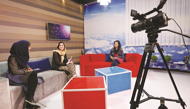 Presenters record their morning programme at the Zan TV station (womenu2019s TV) in Kabul.