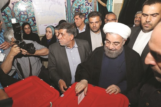 Iranu2019s President Hassan Rouhani casts his ballot during the presidential election in Tehran.