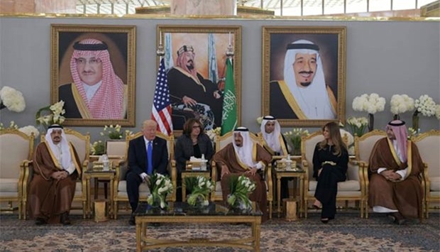 President Donald Trump and Saudi Arabia's King Salman bin Abdulaziz al-Saud along with First Lady Melania Trump are seen in the terminal of King Khalid International Airport following Trump's arrival in Riyadh on Saturday.