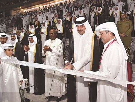 HH the Emir Sheikh Tamim bin Hamad al-Thani cuts the ribbon to inaugurate the Khalifa International Stadium yesterday, declaring it ready to host the Qatar 2022 FIFA World Cup.