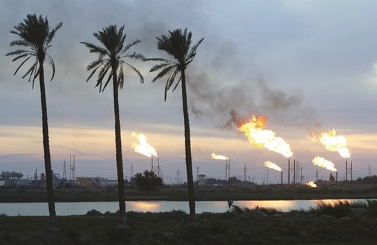 Flames emerge from flare stacks at the oil fields in Basra. Iraq is on track for what may be the countryu2019s highest monthly crude exports even as the Middle East nation supports moves to extend Opec-led production cuts aimed at trimming bloated global inventories.