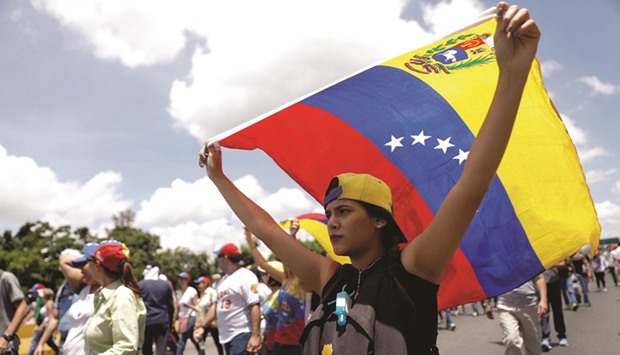 Opposition supporters gather for a rally yesterday against Venezuelau2019s President Nicolas Maduro in Caracas.