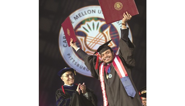 A graduate celebrates his achievement.