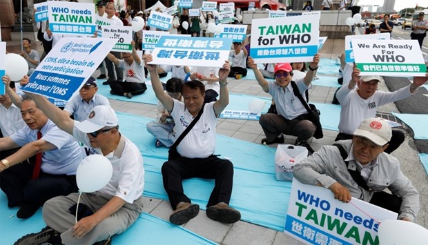 Protesters take part in a rally in Taipei against Taiwan being excluded from U.N.'s annual World Health Assembly in Geneva