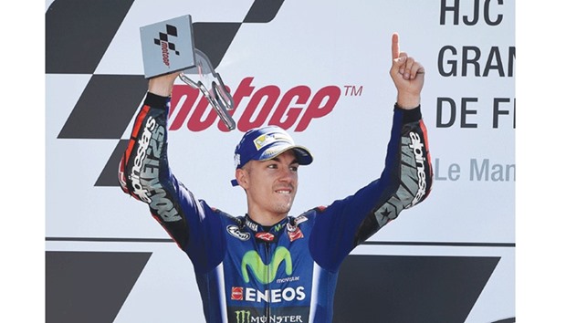 Spanishu2019s rider Maverick Vinales jubilates on the podium after winning the French Grand Prix in Le Mans, France, yesterday. (AFP)