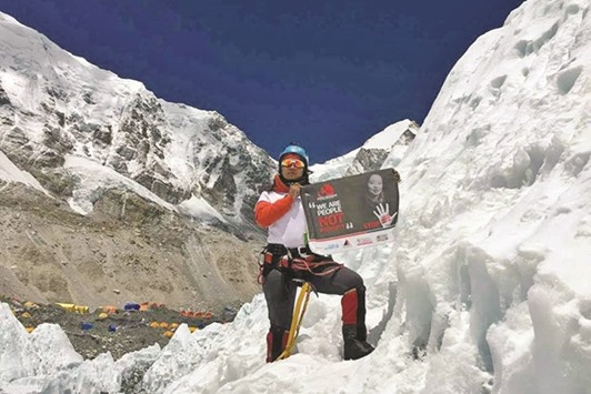 Kanchhi Maya Tamang poses for the camera on Mt Everest.
