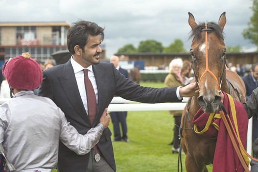 HE Sheikh Joaan bin Hamad al-Thani leads in Al Shaqab Racingu2019s Denaar after Frankie Dettori (left) rode the two-year-old to victory in the Olympic Glory Conditions Stakes on Al Shaqab Lockinge Day at Newbury, England, on Saturday.