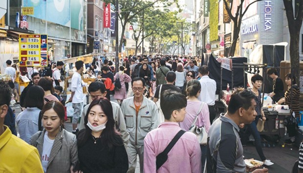 Shoppers are seen in the popular Myeongdong shopping area of Seoul. Chinau2019s recent boycott of South Korea over a US anti-missile shield on the Korean peninsula signals a growing aggression in the way it flexes its economic muscles, analysts say.
