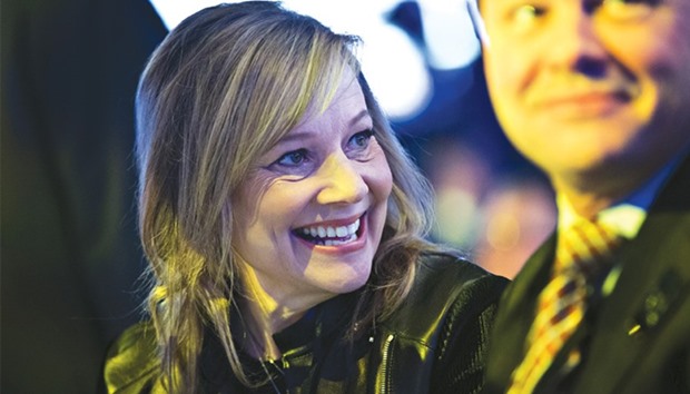 General Motors CEO Mary Barra (left) smiles before the start of a Chevrolet event during the 2017 North American International Auto Show in Detroit. GM has announced plans to add jobs in Michigan even as it moving ahead with cuts to production.
