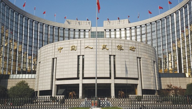 The Peopleu2019s Bank of China headquarters is seen in Beijing. With the deleveraging campaign erasing around $500bn from local stocks and debt, the central bank boosted cash injections and provided more seven-day funds, the cheapest form of financing it offers.