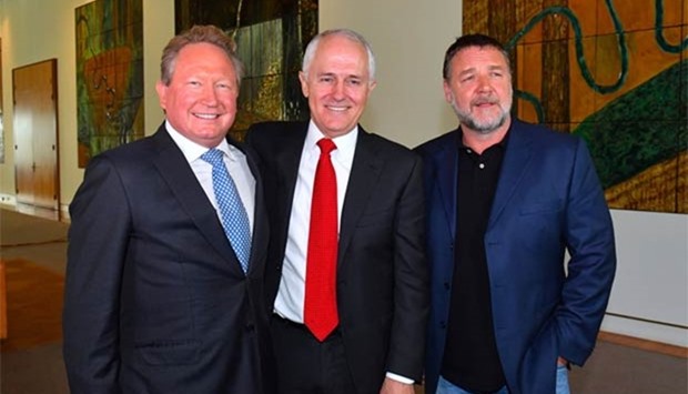 Australian mining magnate Andrew Forrest stands with PM Malcolm Turnbull and actor Russell Crowe as they attend a ceremony announcing his pledge of A$400mn, at Parliament House in Canberra.