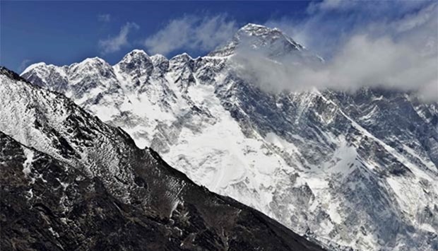 Mount Everest and the Nupse-Lohtse massif are seen from the village of Tembuche in the Kumbh region of north-eastern Nepal.