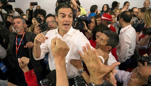Socialists' Pedro Sanchez celebrates victory with supporters