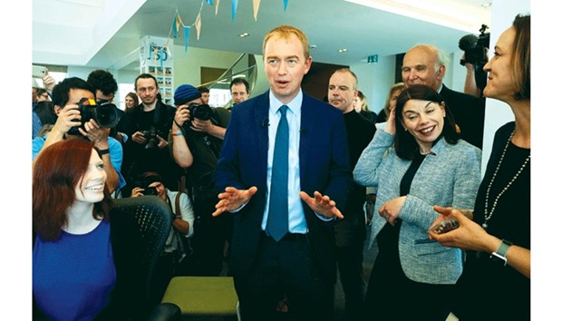 Liberal Democrats leader Tim Farron visits the headquarters of food manufacturer Graze, in south west London, yesterday as part of the general election campaign.