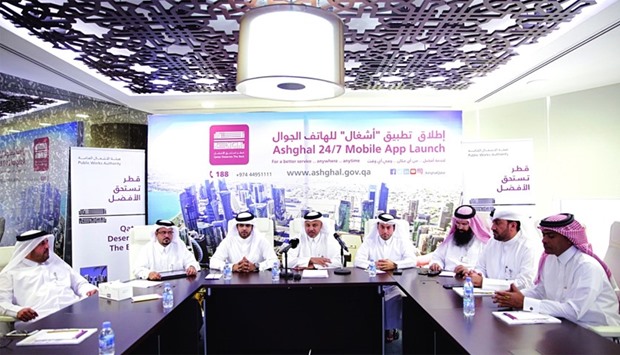 Ashghal officials announcing the launch of the 24/7 mobile apps at a meeting