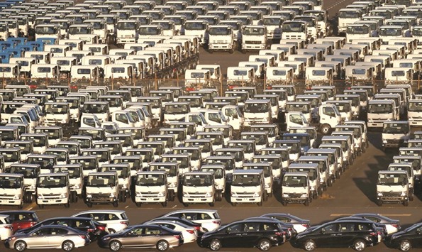 Newly manufactured cars and trucks await export at a port in Yokohama. Japanu2019s exports rose 7.5% in April from a year ago, below the median estimate of 7.8% annual growth, finance ministry data showed yesterday.
