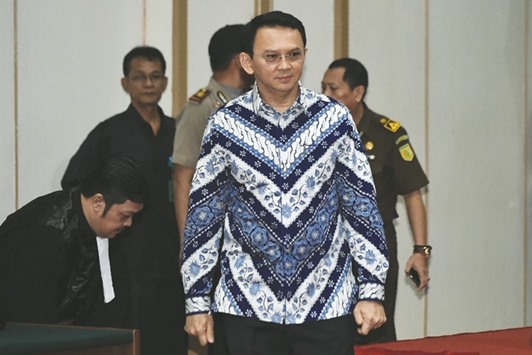 Jakartau2019s governor Basuki Tjahaja Purnama, popularly known as Ahok, arriving at a courtroom for his verdict and sentence in his blasphemy trial in Jakarta.