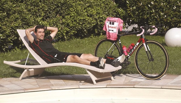 Tom Dumoulin poses by the pool in Boario Terme yesterday. (AFP)