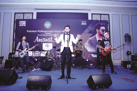 Singer Amanat Ali performing at the event.