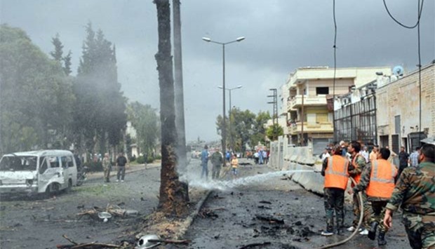 A fire is being put off after an explosion in the al-Zahraa neighbourhood of Homs city on Tuesday.