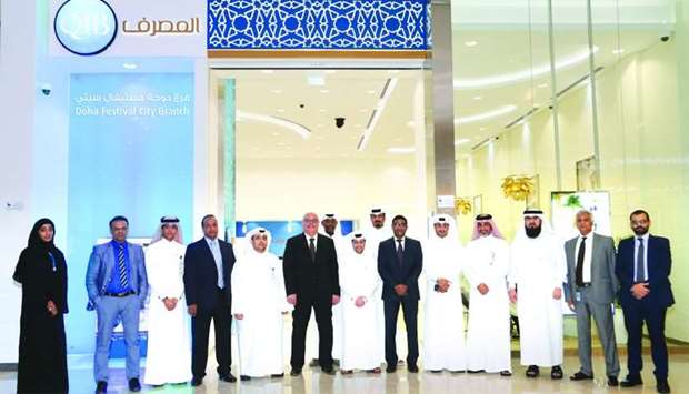 Officials mark the opening of QIB's Doha Festival City branch