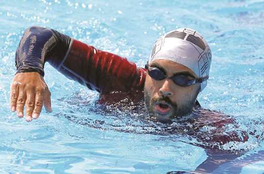 Egyptian swimmer Omar Hegazy, who is the first one-legged man to swim across the Gulf of Aqaba from Egypt to Jordan, during practice in Cairo.