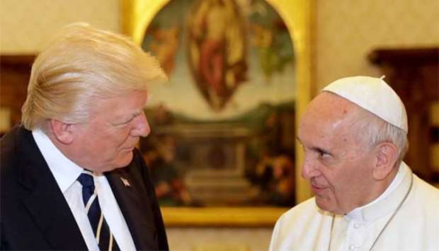 Pope Francis talks with US President Donald Trump during a private audience at the Vatican, on Wednesday.