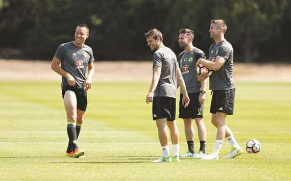 Chelseau2019s John Terry (left) laughs with teammates during a training session ahead of this weekendu2019s FA Cup final against Arsenal.