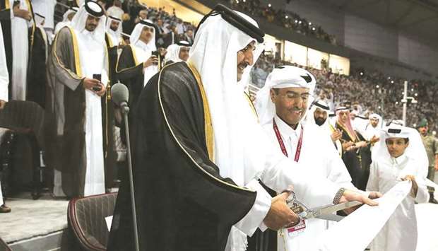HH the Emir Sheikh Tamim bin Hamad al-Thani cutting the ribbon to open Khalifa International Stadium, declaring it ready to host the 2022 FIFA World Cup.
