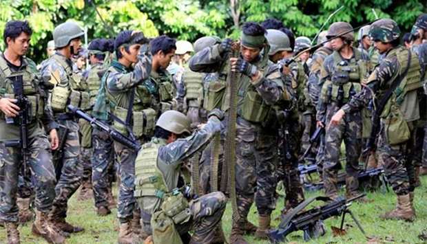 Government troops prepare for their assault with insurgents from the so-called Maute group, who have taken over large parts of Marawi City, on Thursday.