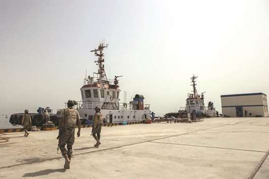 Members of the security forces walk along the dock at Gwadar Port in Gwadar, Balochistan, Pakistan on August 3, 2016. Gwadar is the cornerstone of Chinese President Xi Jinpingu2019s so-called One Belt, One Road project to rebuild the ancient Silk Road, a trading route connecting China to the Arabian Sea that slices through the Himalayas and crosses deserts and disputed territory to reach this ancient fishing port, about 500 miles by boat from Dubai.