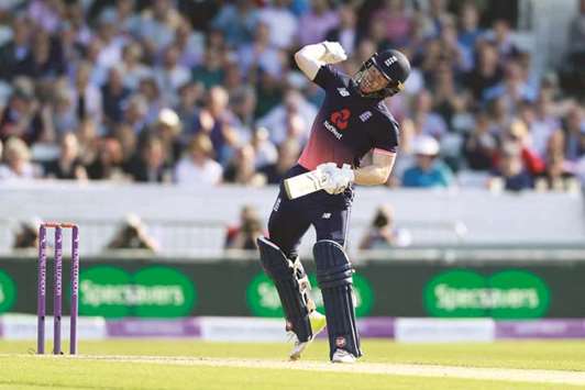 Englandu2019s Eoin Morgan celebrates after making a century against South Africa on Wednesday. (Reuters)