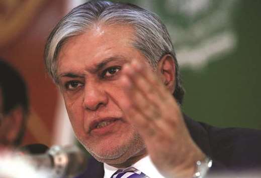 Pakistanu2019s Finance Minister Ishaq Dar gestures during a news conference to announce the economic survey of fiscal year 2016-2017, in Islamabad yesterday.