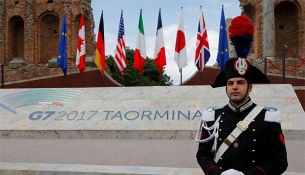 A carabinieri stands gaurd at the site of the G7 summit in Taormina, Italy on Friday.