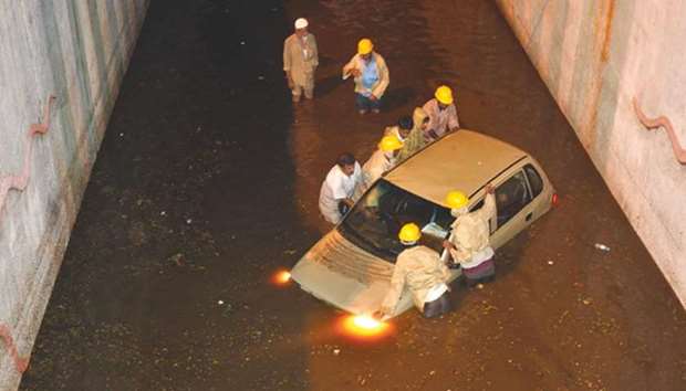 A car gets stuck in a waterlogged underpass after heavy rains in Bengaluru.