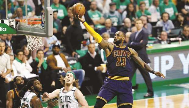 Cleveland Cavaliers LeBron James (right) attempts a layup against Boston Celtics during the Eastern conference finals in Boston. (USA TODAY Sports)