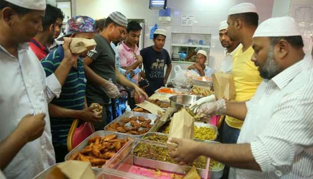 Restaurant staff cater to customers buying iftar food. PICTURE: Jayan Orma