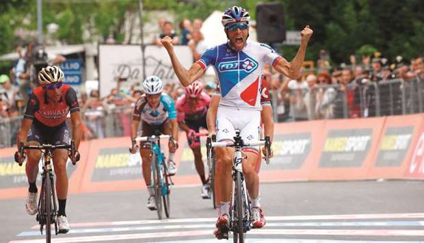 French cyclist Thibaut Pinot of Team FDJ crosses the finish line to win the 20th stage of 100th Giro du2019Italia from Pordenone to Asiago in Asiago, Italy. (AFP)
