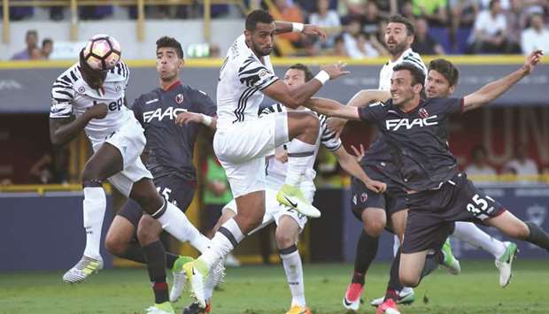 Juventusu2019 Moise Kean (left) scores during the Italian Serie A match against Bologna at the Renato Dallu2019ara stadium yesterday. (AFP)