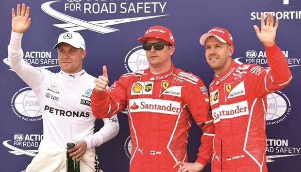 Ferrari driver Kimi Raikkonen (centre) will start todayu2019s Monaco Grand Prix ahead of teammate Sebastian Vettel (R) and Mercedesu2019 driver Valtteri Bottas. (AFP)