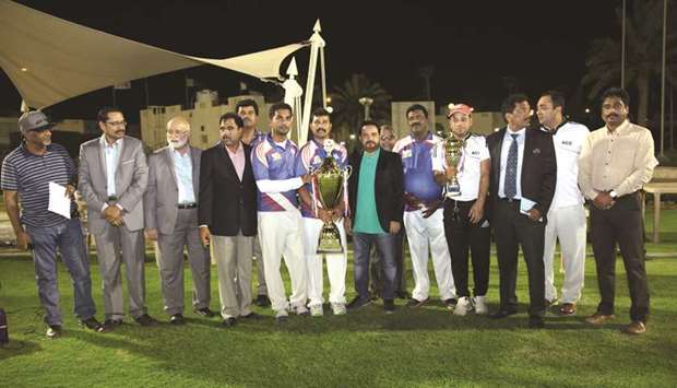 Captains of champions M. Pallonji and runners-up Asian Cricket Club pose with their respective trophies, Qalco operations director Shahid Iqbal Chaudhry and Qatar Veteransu2019 Officials after the Qalco Day-Night Cricket Tournament 2017 final on Thursday.