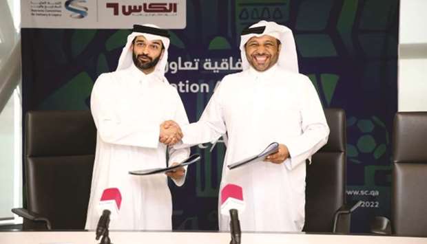 SC secretary general Hassan al-Thawadi (left) and Al Kass general manager Essa bin Abdulla al-Hitmi signed the agreement.