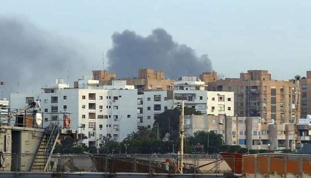 Smoke rises in the center of the Libyan town of Derna