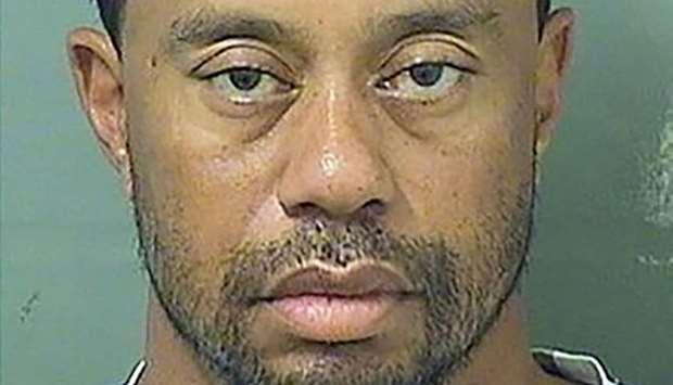 Tiger Woods, pictured after his arrest, had spinal fusion surgery on April 20.
